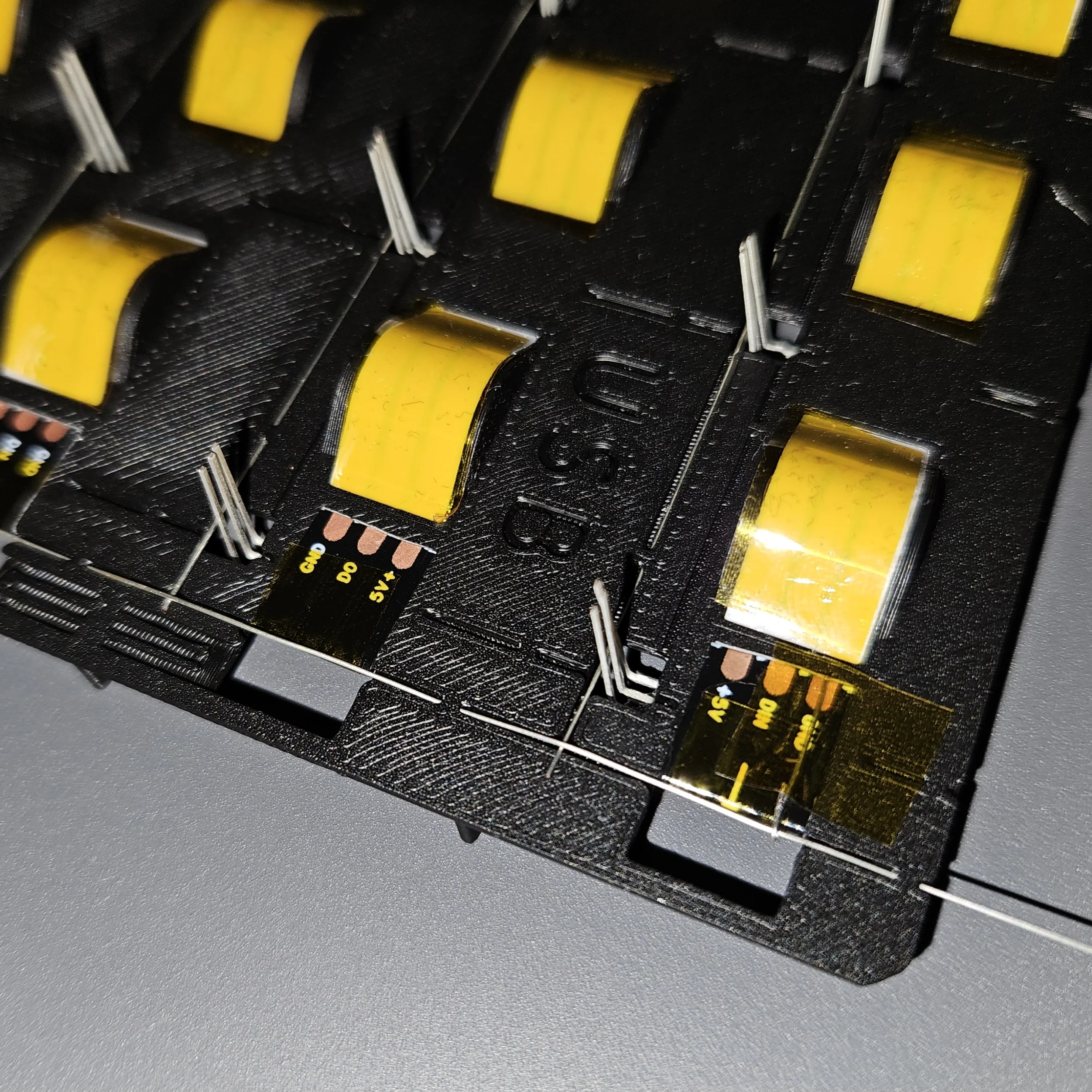 Passing GND wires through guides